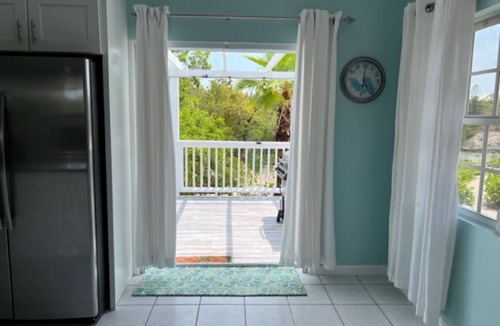 Cooper Jack Bay Settlement Villa | Waterfront Villa with Dockside Patio, Paddleboards & Pontoon Boat Rental option