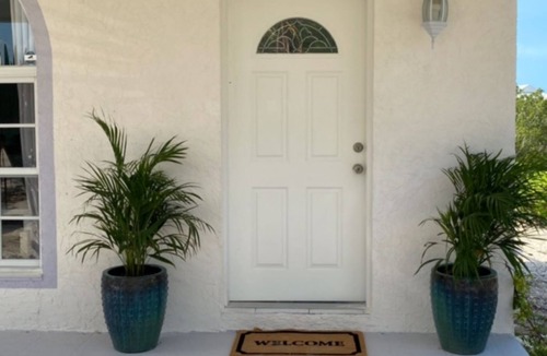 Cooper Jack Bay Settlement Villa | Waterfront Villa with Dockside Patio, Paddleboards & Pontoon Boat Rental option