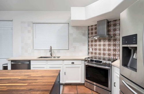 Fox Crossing Villa | Waterfront Villa with Pool Hot Tub Lounge area