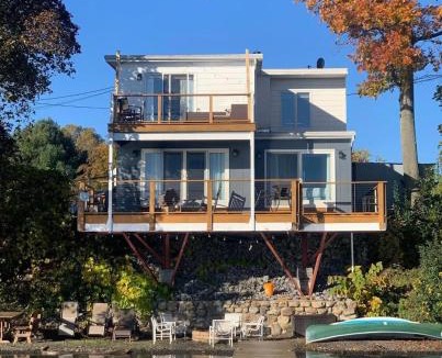 Geneva House | Waters Edge Lakefront with Kayaks Fire Pit and Dock