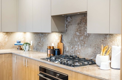 Central Okanagan Condo | Welcome to Zara at Lakestone! A premier lakeside community for a peaceful escape with pickleball courts, gym, and sauna. Spacious 3-bed, 3-bath suite with lake & hillside views, chef’s kitchen, private patio w/BBQ & workspace.