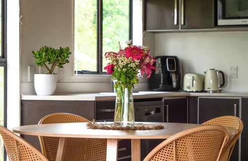 Paihia Cottage | Whimsical Chalet - perfectly formed quaint cottage surrounded by lush greenery
