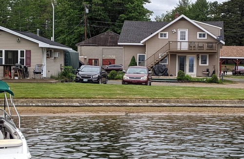 Winnisquam House | Winnisquam Lakeside Funky Ski Chalet w-Sandy Beach & Boat Docks