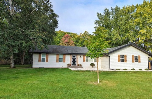 Wausau House | Wooded waterfront retreat with hot tub & fire pit