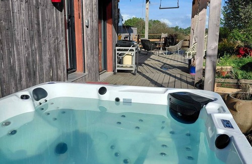 Nivillac House | Wooden house with a large deck and a 5-person hot tub, not overlooked