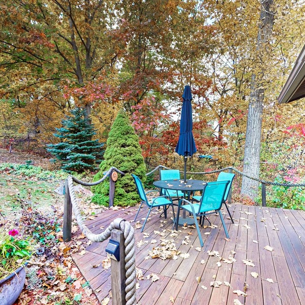 1-acre lakefront log cabin with dock, 50 ft water frontage, hot tub, & deck