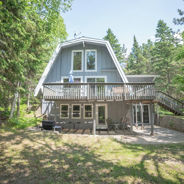 A-frame cabin with sandy swimming beach, 4 bedrooms, and amenities of home.