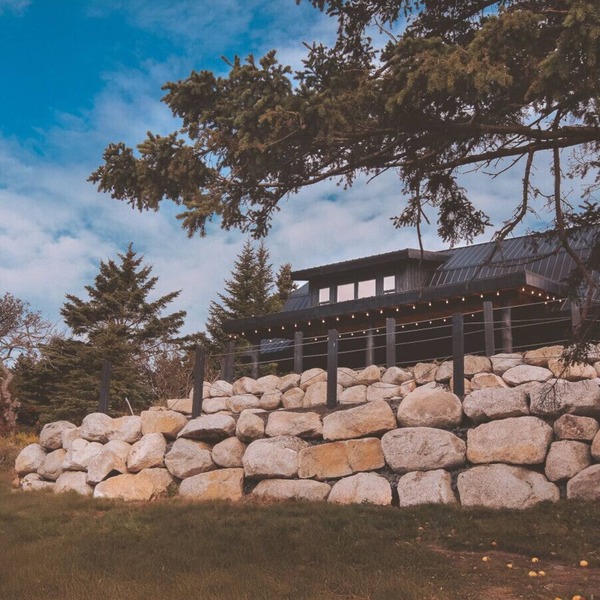 A reconstructed German LogHaus and sanctuary of unmediated coastal observation.