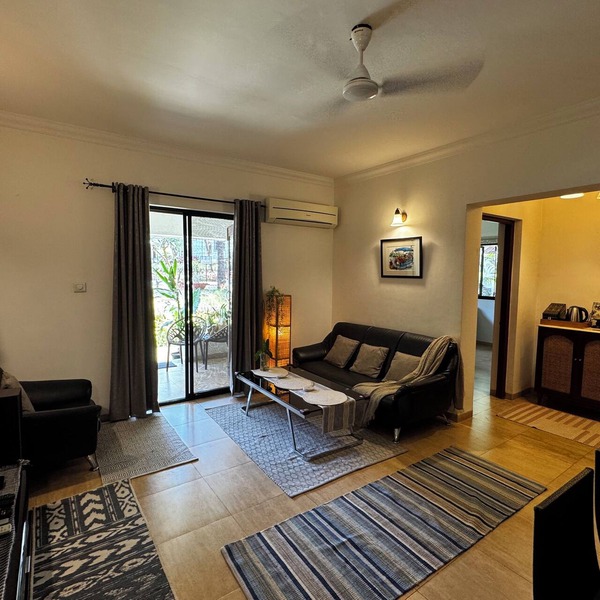 A spacious 2BHK poolside apartment nestled in the foothills - 8min from beach.