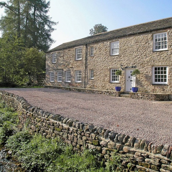 A spacious detached cottage located by a beck in a quiet village.