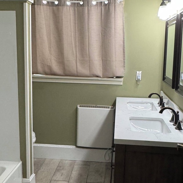 All one floor Charming large 2 bedroom, LR, sunroom, kitchen 2 baths wt laundry.