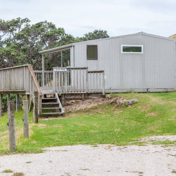 Basic holiday cabin with its own private sandy bay
