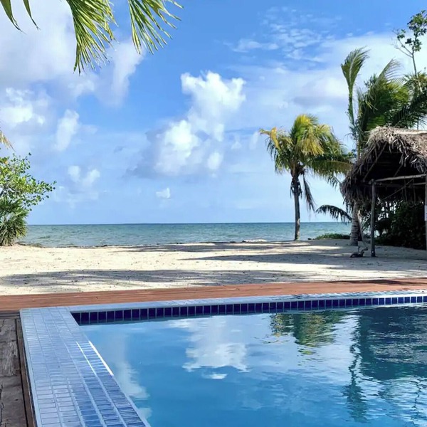 Beachfront Paradise: Pool, Volleyball & Rooftop