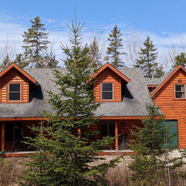 Beautiful Log Home on 5 acres private beach-steps down the road!