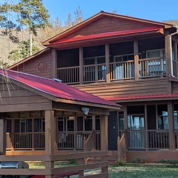 Beautiful rustic lodge located on Lake Guntersville with private boat ramp/dock.