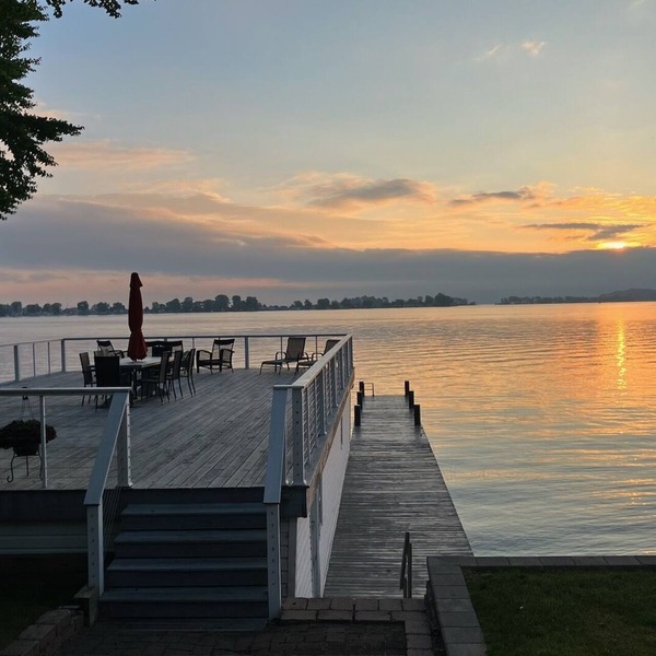 Beautifully updated home on the bay and golf course with dock and raised deck!