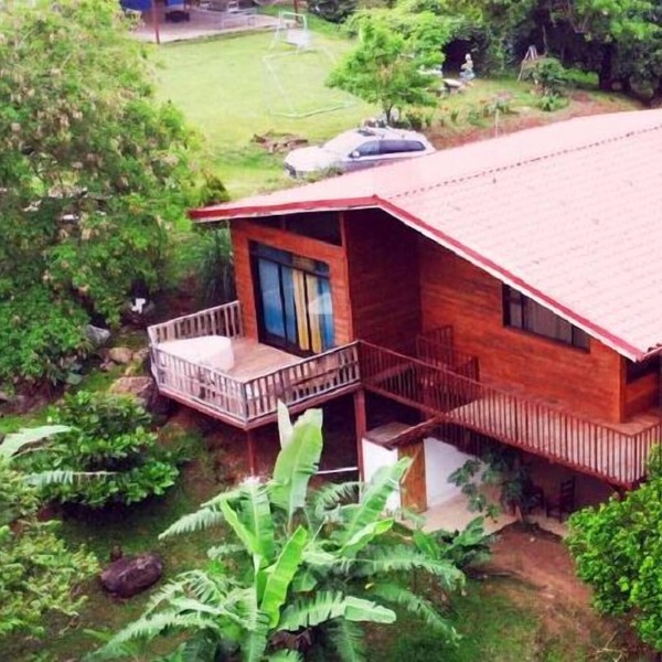 Cabin surrounded by nature at ground level with terrace