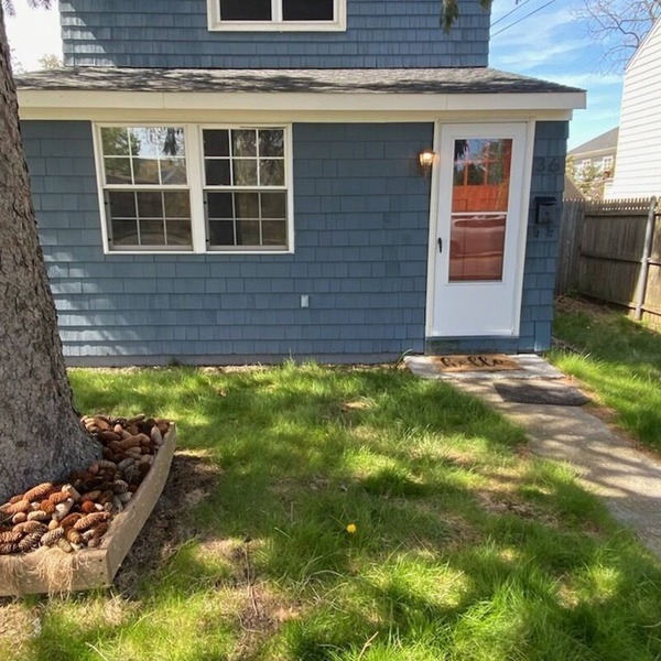 Charming Riverhead home with large outdoor patio & backyard firepit