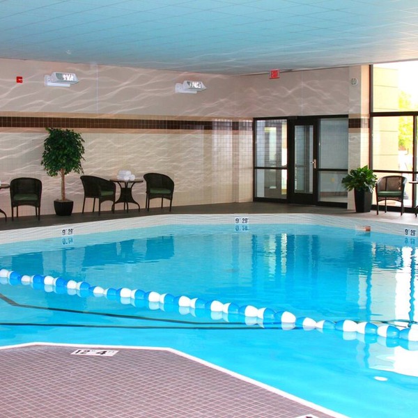 Comfortable Suite Near Hancock International Airport | Free Breakfast + Fitness Center