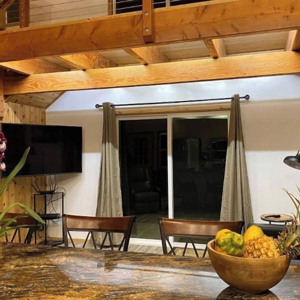 Custom cottage feels bright & airy yet cozy and private in this country setting.