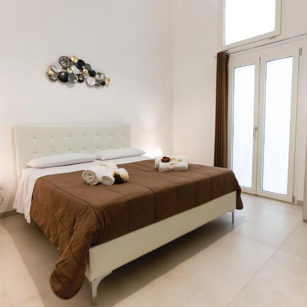 Elegante Bilocale con Giardino