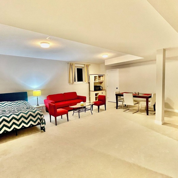 Entire basement with large windows, private full bathroom and office