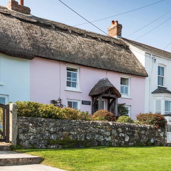 Just a stone's throw away from the water's edge, thatched Trevarrow Cottage is the ideal place to un