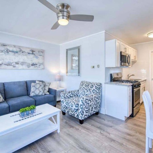 Lakefront corner condo with canoes, resort pool, tennis & firepit - dogs welcome