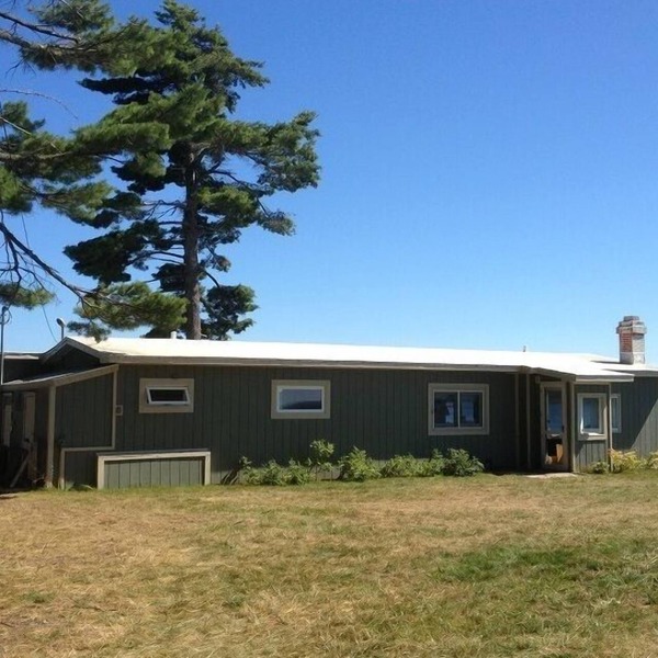 Lakefront, spectacular views with water on both sides, deep water dock.