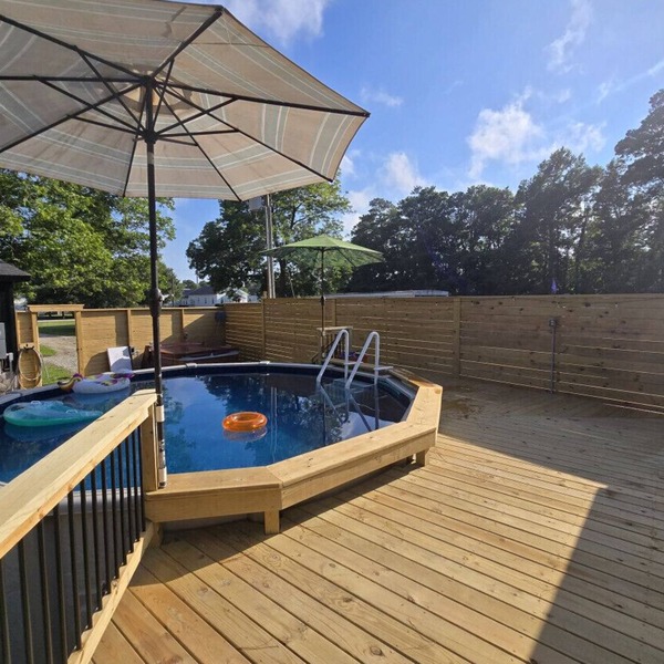 Large Summer Getaway near the beach with private pool, Hottub, and firepit, three miles to Beach.