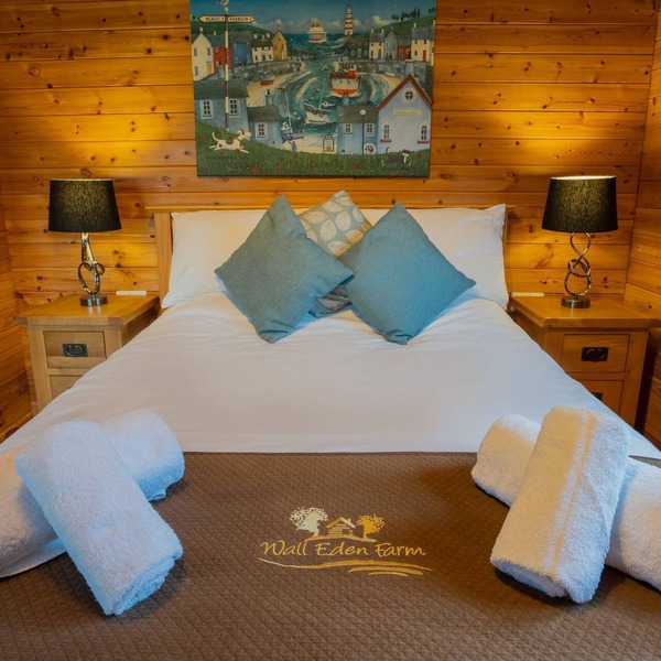 Large three bedroom log cabin with private hot tub and decking over looking the beautiful river Brue