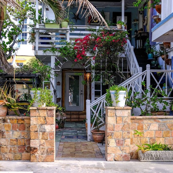 Located steps from the ocean, offering true beach living.