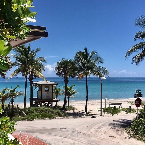 Located steps from the ocean, offering true beach living