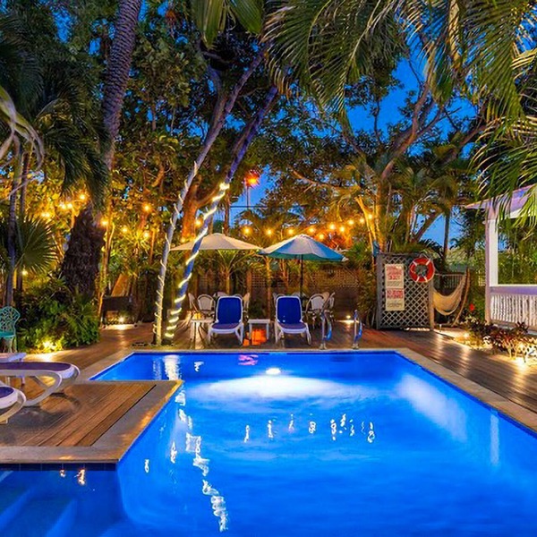 Multi-home tropical paradise with large, heated pool, & wraparound sundeck
