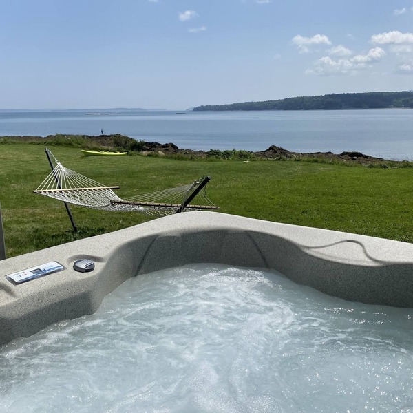 Oceanfront cabin with private beach and hot tub