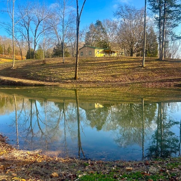 Peaceful Hills Retreat’s cottage is clean and cozy with a creek on 97 acres