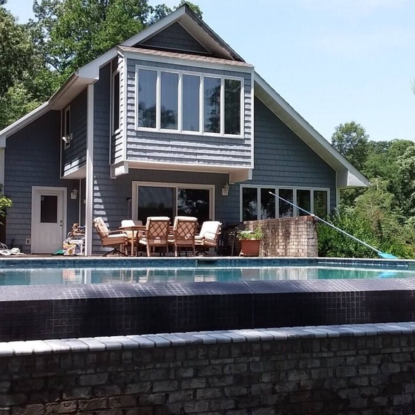 Private infinity pool, plus your own dock, kayaks, and bikes on the waterfront!