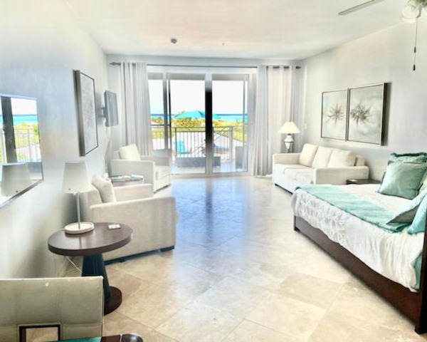 Private Poolside, Loft-Like Condo with Panoramic Grace Bay Views, Walk to Beach, Restaurants, & Turtle Cove Marina!