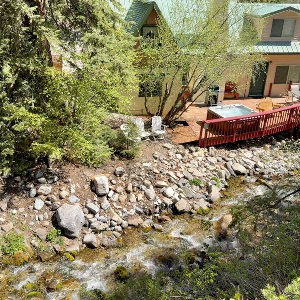 Quiet streamside retreat Hot Tub Deck overlooking the creek Wood-burning stove Tucked below Sundance