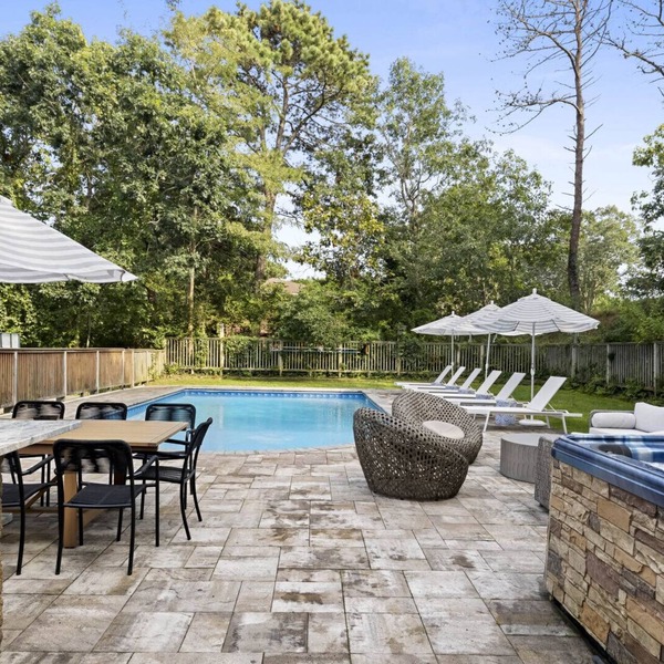 Re-modernized home with heated saltwater pool, home office, gym, electric.
