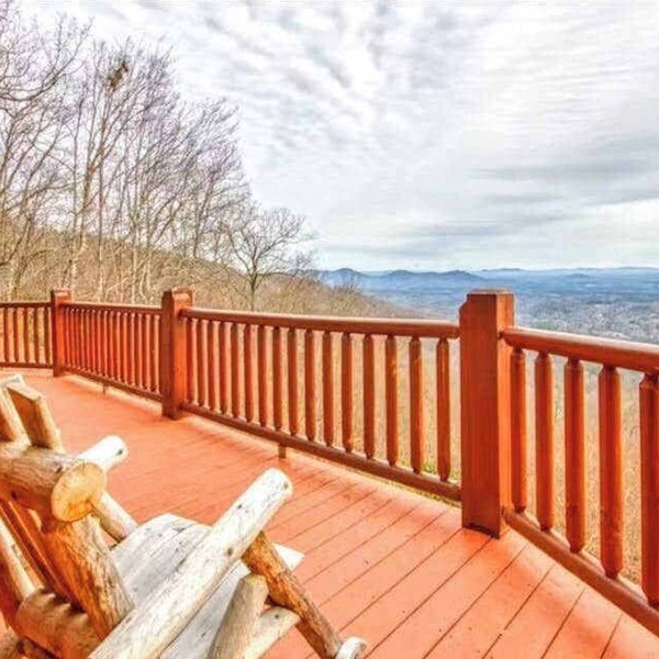 Rustic mountain-view home with deck, fire pit, hot tub, fireplace, & game room