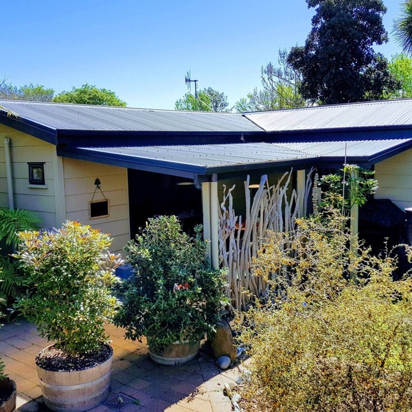 Secluded Riverside Cottage set in native garden.
