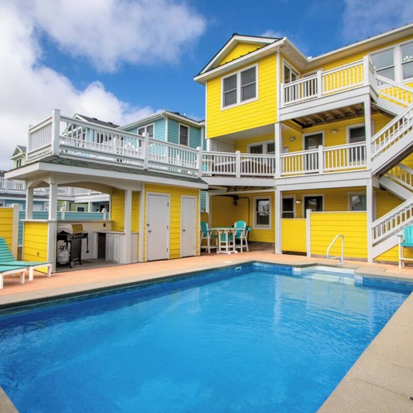 Semi-Oceanfront Home with a Large Pool Area, Cabana, and Rec Room by Sun Realty