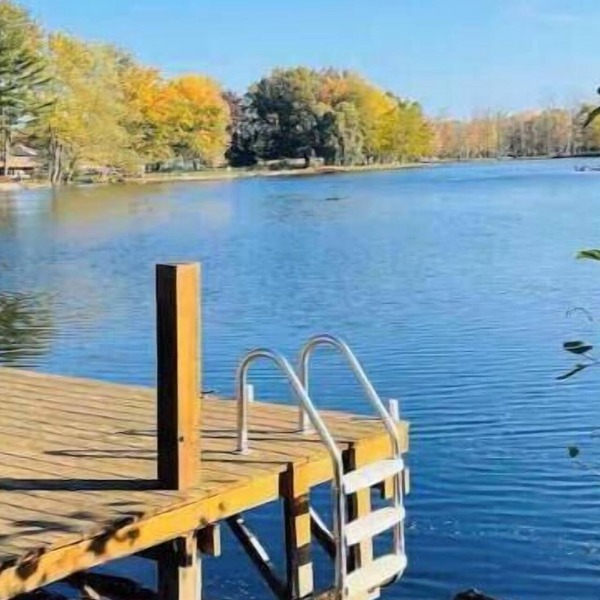 Spacious 4-bedroom waterfront house in Sylvan Beach with private yard and dock.