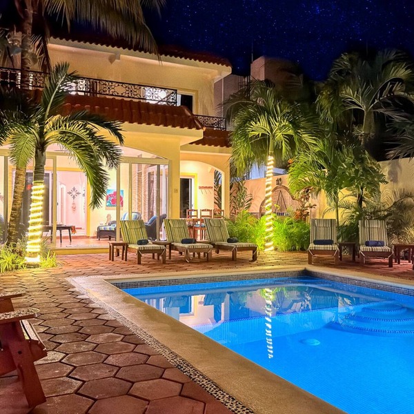 Spacious Hacienda style home with charming garden, screened porch and pool
