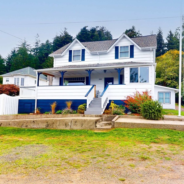 Spacious home with river views, hot tub, covered porch, deck, grill, & W&D