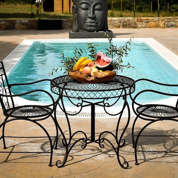 Stone farmhouse with pool.