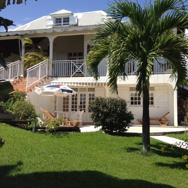 Studio South East, large terrace facing the sea in tropical garden.