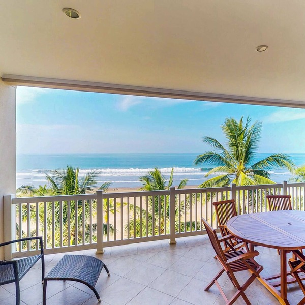 Stunning beachfront condo with WiFi, shared pool, & sweeping ocean views