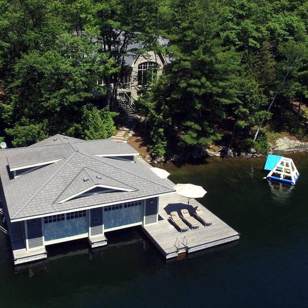 Stunning Cottage on Lake Joe! 6 bdrm,6 bath,2 slip boathouse! Water Toys Galore!